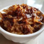 Close-up of deeply caramelized onion topping, ready for making caramelized onion dip.