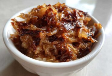 Close-up of deeply caramelized onion topping, ready for making caramelized onion dip.