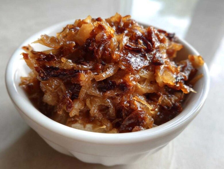 Close-up of deeply caramelized onion topping, ready for making caramelized onion dip.
