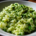 Close-up of creamy Spring Pea and Mint Risotto topped with chopped fresh herbs.