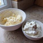 Two bowls showing ingredients for ies: one with creamed butter/sugar mixture and one with whipped cream filling.