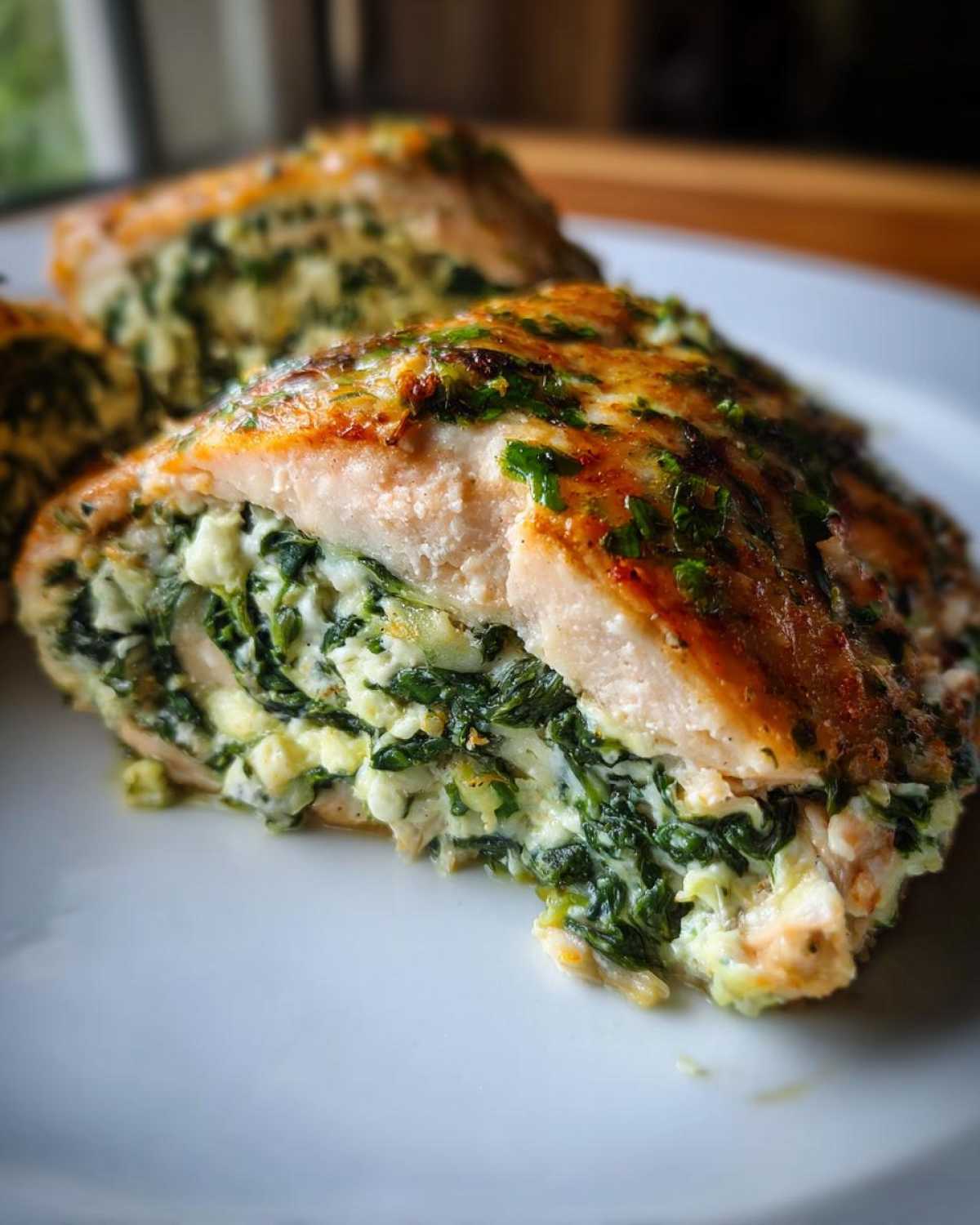 Cross-section of One-Pan Creamy Spinach Feta Stuffed Salmon showing the rich filling.